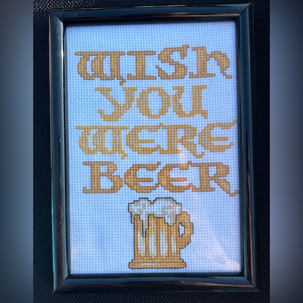 Handmade cross stitch. “Wish you were beer”